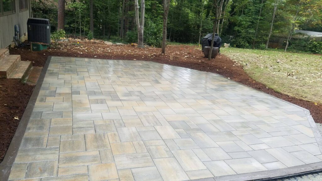 outdoor patio project by GrassMaster with stone pavers