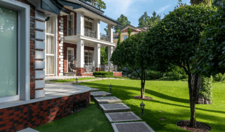 Lawn care for front yard with stone path